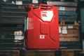 Red Wavian 20L NATO jerry can on a wooden crate in the Swiss-Link warehouse
